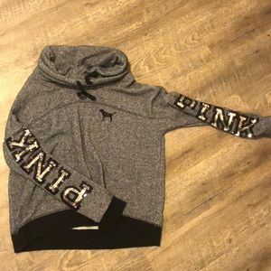 Pink long sleeve grey and black sweater